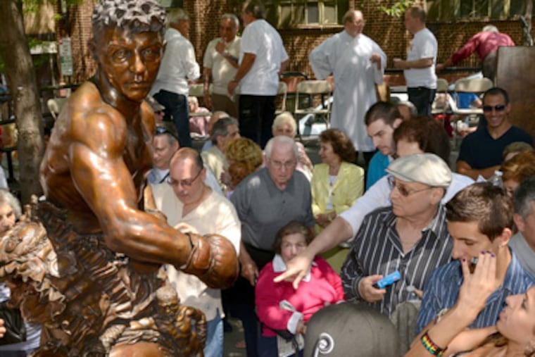 A crowd gathers around the statue of Joey Giardello after an unveiling on Saturday. (Tom Gralish / Staff Photographer)