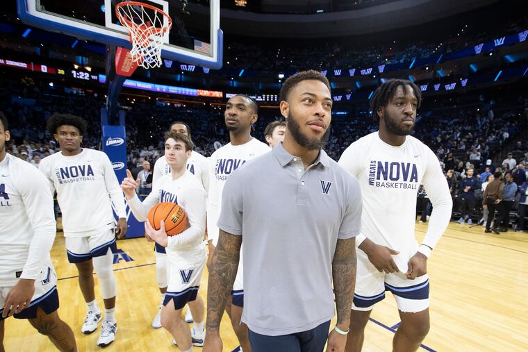 Justin Moore (center) has been practicing and could return sooner rather than later for the Wildcats.
