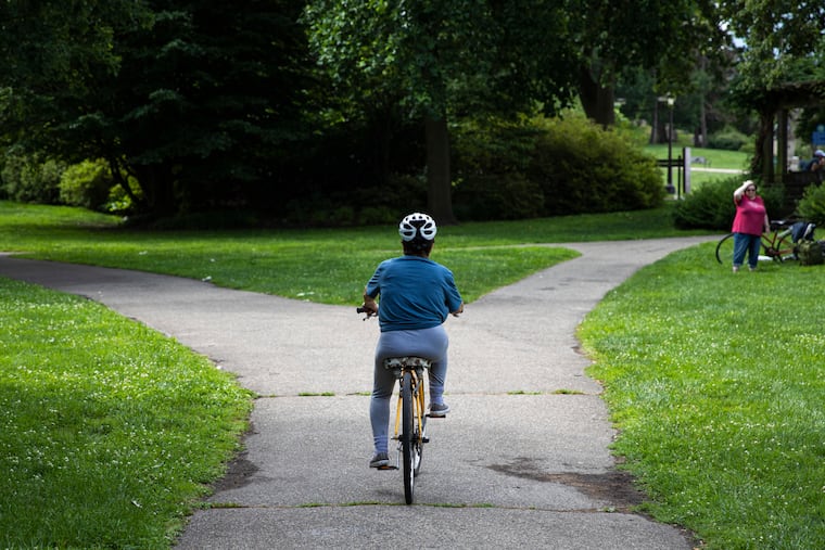 Inquirer Reporter Rita Giordano successfully rides a bike on her own for the first time in her life following a biking lesson sponsored by The Bicycle Coalition of Philadelphia.