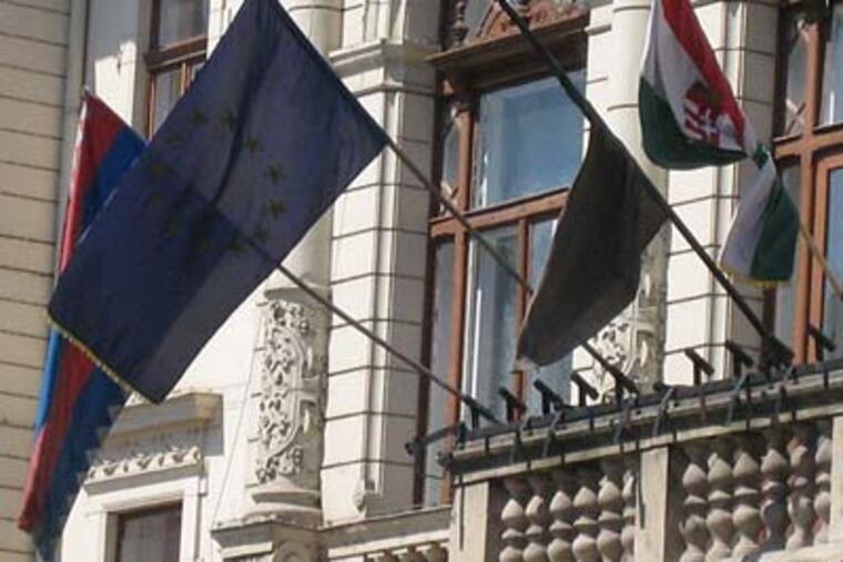 A black flag flies at City Hall in the Hungarian village of Mosonmagyarovar, the hometown of two tourists who died while on a 'Ride the Ducks' tour in Philadelphia. (Melissa Dribben / Staff)