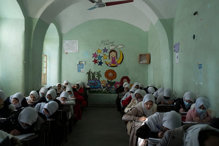 Afghan girls participate a lesson inside a classroom at Tajrobawai Girls High School, in Herat, Afghanistan, Thursday, Nov. 25, 2021. While most high school girls in Afghanistan are forbidden to attend class by the country's Taliban rulers, one major exception are those in the western province of Herat. For weeks, girls there have been attending high school classes, thanks to a unique effort by teachers and parents to persuade local Taliban administrators to allow schools to reopen.