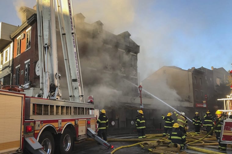 Philadelphia firefighters at at the scene of Bridget Foy’s restaurant at 2nd and South Streets around 8 a.m. Wednesday, Oct. 25, 2017. The fire started at about 1:15 a.m. in the Queen Village neighborhood.