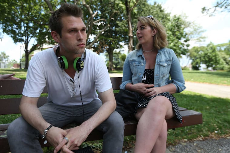 Ryan Sipler, left, and Angela Caruso, right, both of Delaware, who wound up in Philly chasing heroin and are now in treatment, pause on a bench in McPherson Square Park in Philadelphia, PA on June 22, 2017.