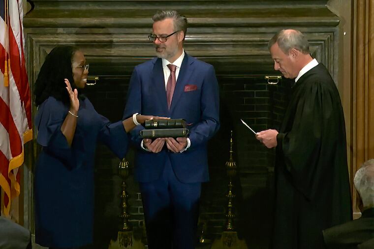 Chief Justice of the United States John Roberts administers the Constitutional Oath to Ketanji Brown Jackson as her husband Patrick Jackson holds the Bible at the Supreme Court in Washington, Thursday, June 30, 2022.