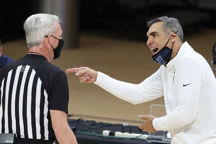 Villanova coach Jay Wright, right, seen arguing with an official during his team's March 3 game against Creighton at Finneran Pavilion, said the lack of a normal routine this season has affected his team.