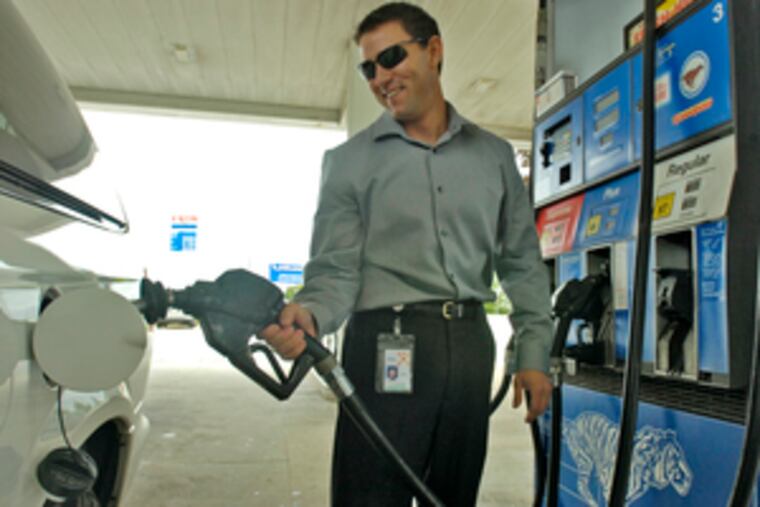 Michael Strader, King of Prussia, filled his car yesterday at Jon Cordisio's Exxon station. Cordisio, who joined state and AAA officials to support the bill, does occasional gas self-checks.