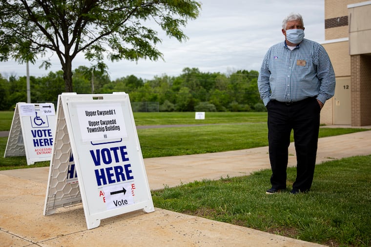 Eric Nelson, of Upper Gwynedd, Pa., stands outside to help voters to their correct polling stations at Pennbrook Middle School on Tuesday, June 2, 2020. Pennbrook Middle School has Upper Gwynedd districts one, three, and seven for people to come and vote.