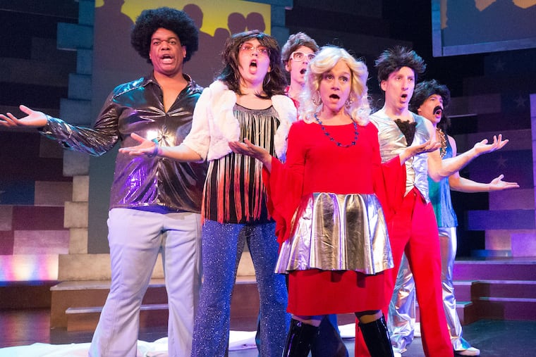 (Left to right:) Rob Tucker, Tanaquil Márquez, Sean Close, Jennifer Childs, Dave Jadico, and Justin Jain in "This Is the Week That Is," through Jan. 5 at 1812 Productions.