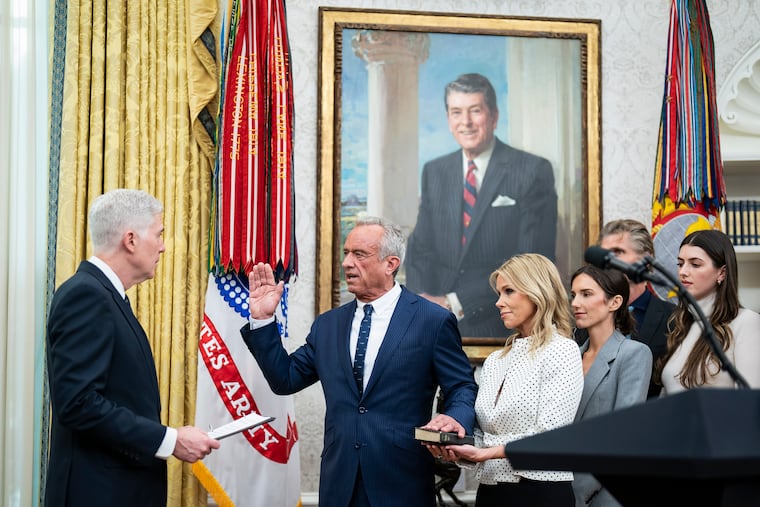 Supreme Court Justice Neil M. Gorsuch swears in Kennedy, accompanied by his wife Cheryl Hines and family, in the Oval Office on Feb. 13. MUST CREDIT: Jabin Botsford/The Washington Post