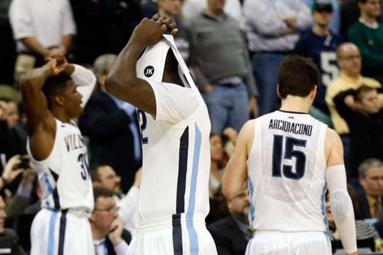Villanova players walk off the court after losing to North Carolina State on Saturday in the NCAA Tournament. (Yong Kim/Staff Photographer)