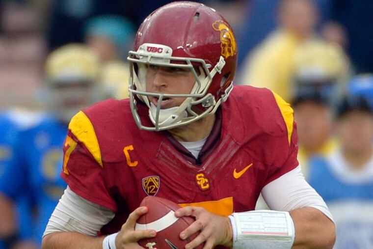 Matt Barkley rolls out to pass during the second half of an NCAA college football game against Southern California, Saturday, Nov. 17, 2012, in Pasadena, Calif. UCLA won 38-28. (Mark J. Terrill/AP file)