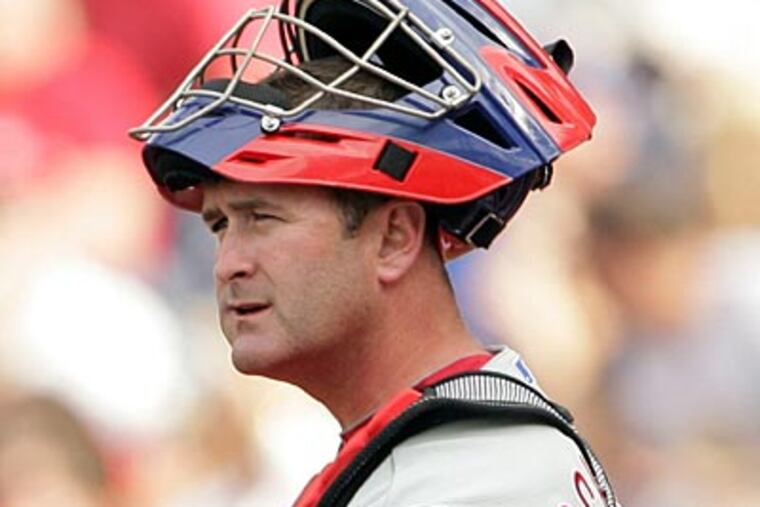 Catcher Brian Schneider said the attitudes of last year's Mets and this year's Phillies are night and day. (Yong Kim / Staff Photographer)