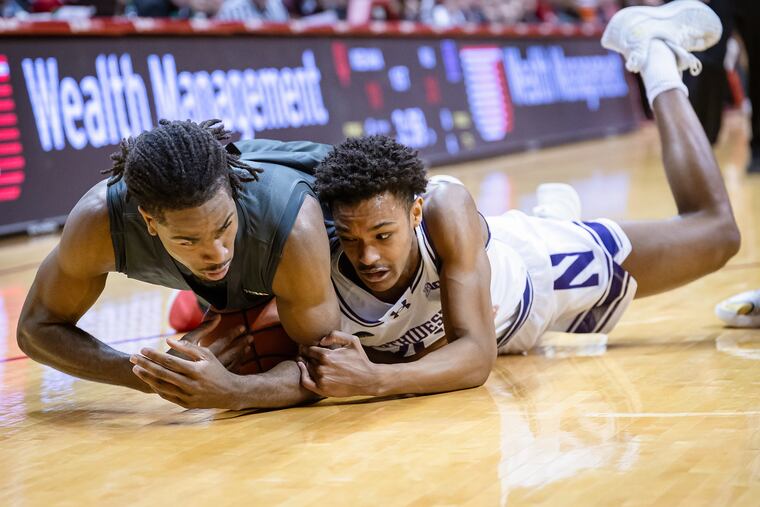 Blake Smith, right, is a Germantown Academy grad who is a walk-on guard for the Northwestern Wildcats. Smith helped the team qualify for the NCAA tournament as a scout team member, and now as a player.