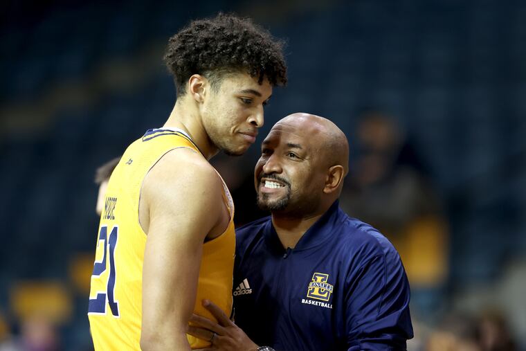 Coach Ashley Howard, right, of La Salle talks with Clifton Moore during a timeout in their game against St. Bonaventure during the 1st half on Jan. 11, 2022.