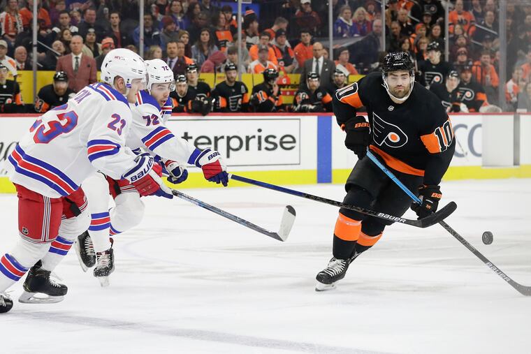 Flyers left winger Andy Andreoff goes after the puck against New York Rangers on Monday.