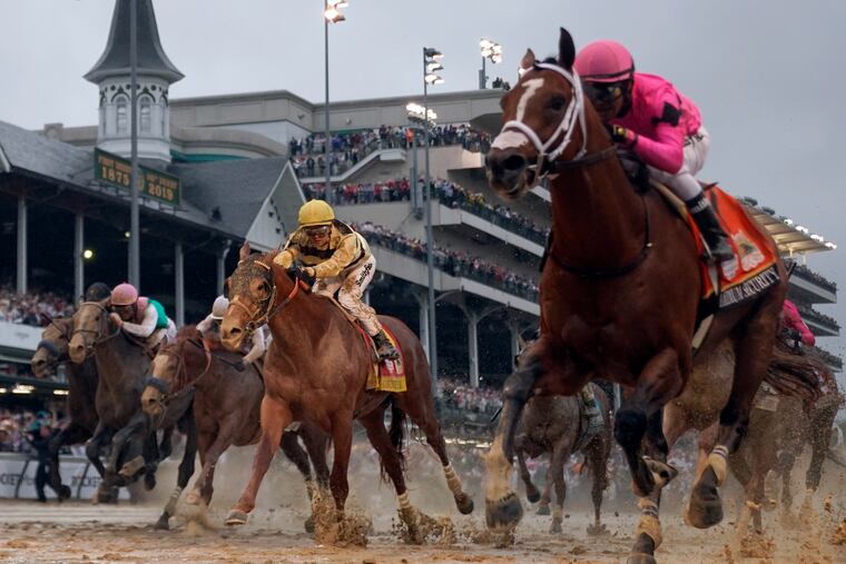 Luis Saez rides Maximum Security, right, across the finish line first against Flavien Prat on Country House during the 145th running of the Kentucky Derby horse race at Churchill Downs Saturday, May 4, 2019, in Louisville, Ky. Country House was declared the winner after Maximum Security was disqualified following a review by race stewards. (AP Photo/Matt Slocum)