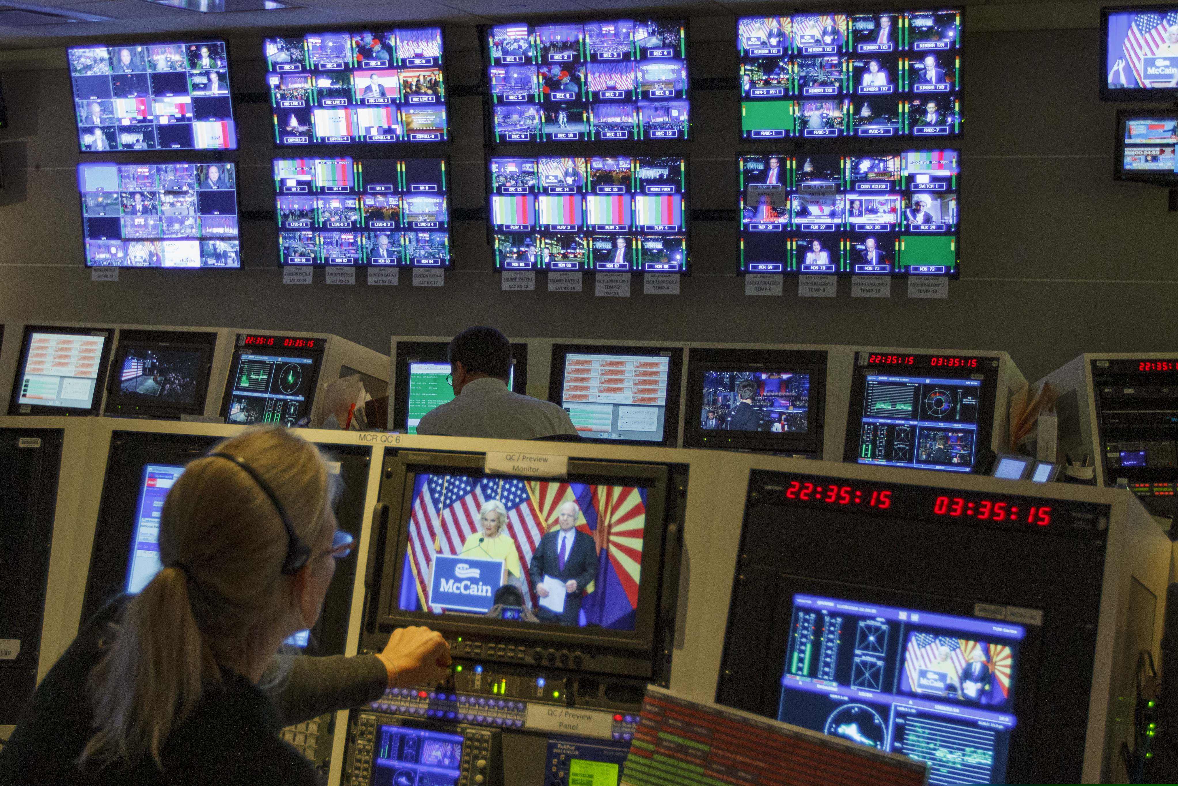In this Nov. 8, 2016, photo, staff members of The Associated Press Television Network work in master control at the Washington bureau of The Associated Press in Washington, as returns come in during election night. The Associated Press says it plans to peel back the curtain and let people know how its experts declare winners and losers on election night. Given high interest in the presidential race, the complicating factor of strong early voting and President Donald Trump's warnings about potential fraud, television executives are making similar promises of transparency.