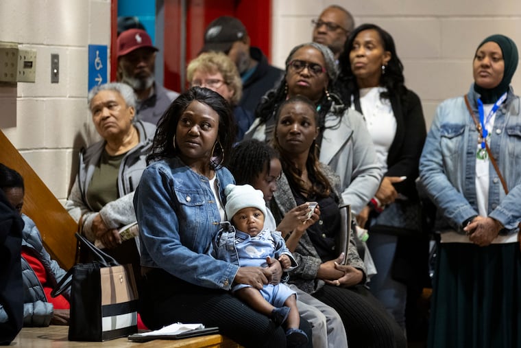 People listen during a community meeting about a recent shooting at the Finley Recreation Center on Tuesday, April 1, 2025 in Philadelphia. Hundreds of community members attended the meeting.