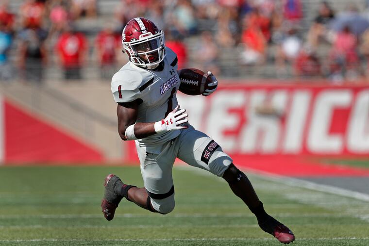 Jason Huntley carrying the ball for New Mexico State on Sept. 21, 2019.