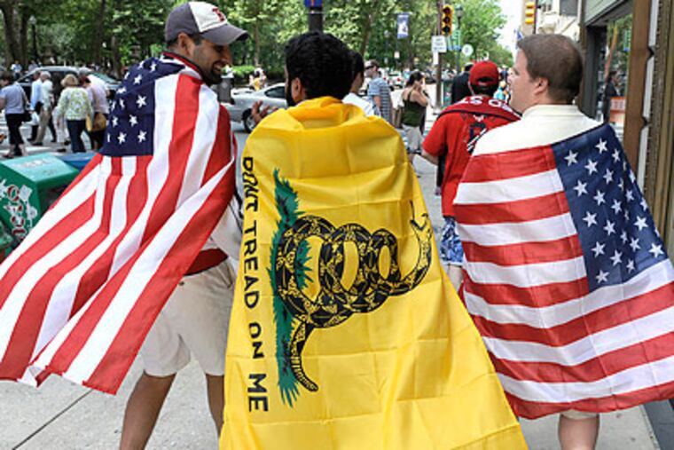Fans celebrated near RIttenhouse Square after the U.S.' dramatic World Cup win over Algeria. (Clem Murray/Staff Photographer)