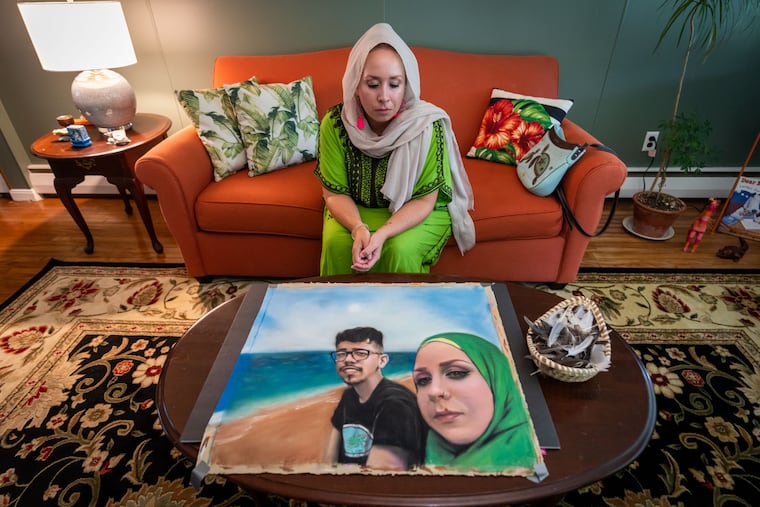 Meredith Elizalde cherishes a portrait, created by artist Laurie Cooper, of her and her son, Nick.