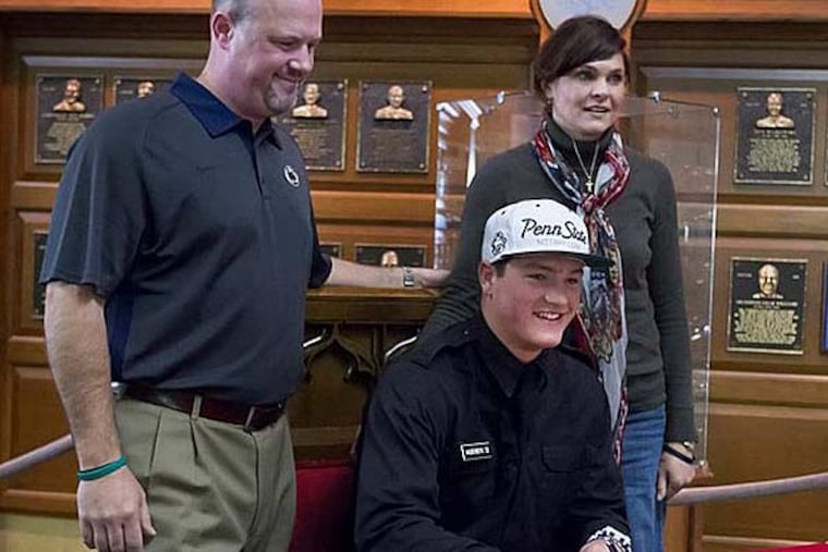 Christian Hackenberg, flanked by his parents, Erick and Nikki, poses at a ceremony celebrating the signing of his letter of intent to attend Penn State University. The highly-touted quarterback is from Fork Union Military Academy in Virginia. (Joe Hermitt/PennLive.com)