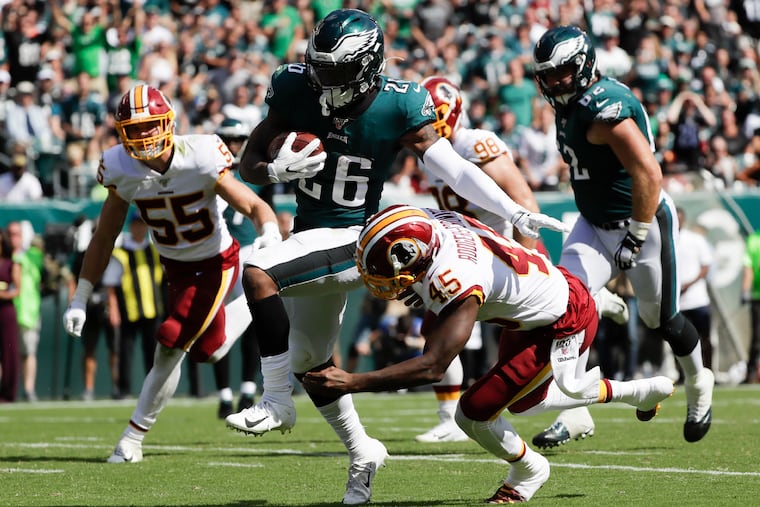 Eagles rookie Miles Sanders runs past Washington cornerback Dominique Rodgers-Cromartie in the Eagles' Week 1 win.