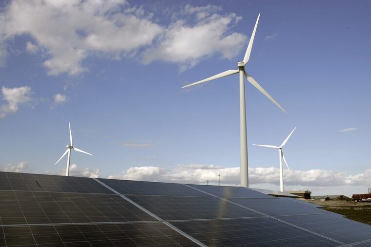 Large windmills and solar panels are seen Monday, Oct. 6, 2008, in Atlantic City, N.J.