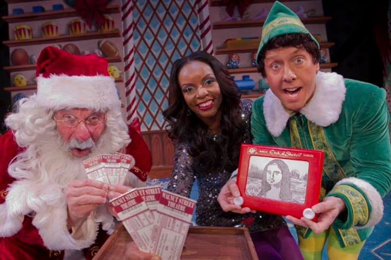 Santa Claus portrayed by Bill Van Horn and Buddy, by Christopher Hutton in Elf at the Walnut Street Theater as seen on Thursday afternoon December 5, 2013 with Jenice Armstrong of the Philadelphia Daily News. Jenice will be giving away tickets to production of Elf for Christmas. ( ALEJANDRO A. ALVAREZ / STAFF PHOTOGRAPHER )