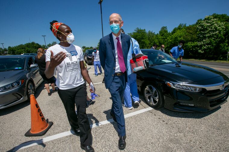 Dr. Ala Stanford (left) walks with Health Commissioner Thomas Farley, M.D., M.P.H. before the start of a presser with Black Doctors COVID-19 Consortium and representatives with the City of Philadelphia. It was held at Enon Tabernacle Baptist Church, 2800 W. Cheltenham Avenue, Philadelphia on Tuesday afternoon, June 9, 2020.