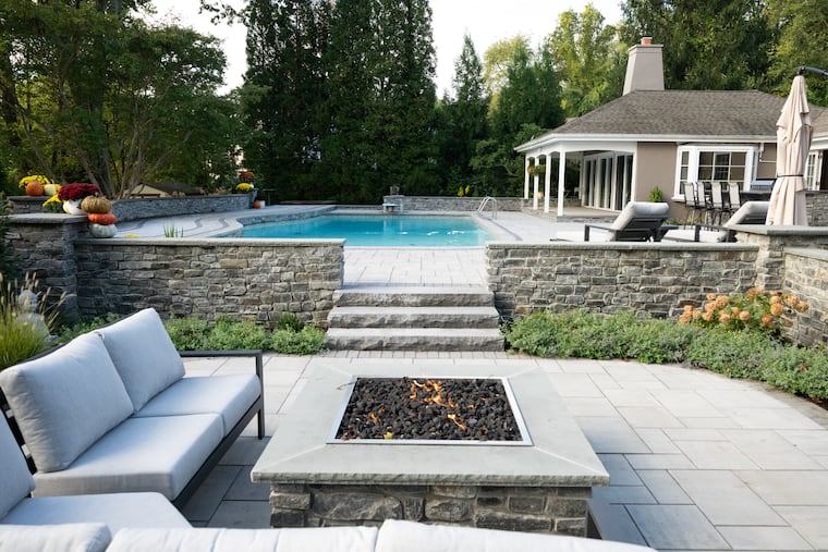 A couple's remodeled Bryn Mawr home has an equally inviting backyard, complete with a swimming pool and fire pit.