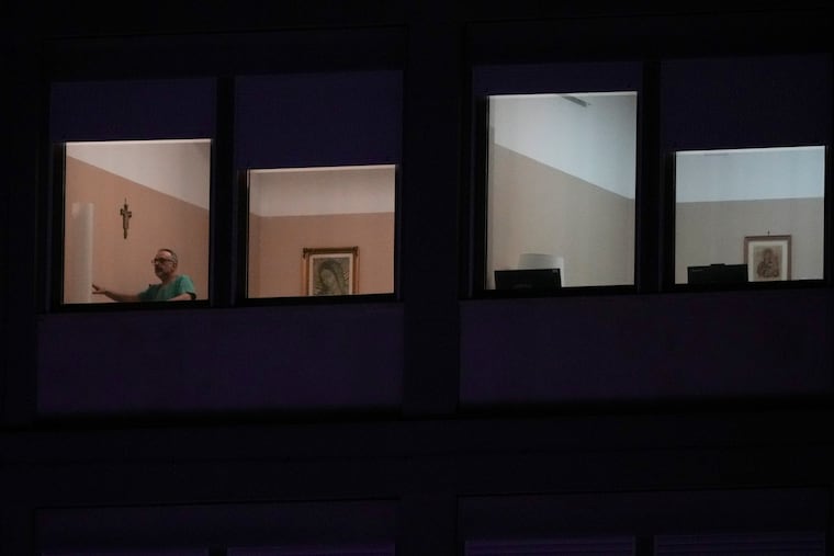 A man walks in the ward where Pope Francis is hospitalized at the Agostino Gemelli Polyclinic in Rome, Italy, on Sunday, March 2, 2025.
