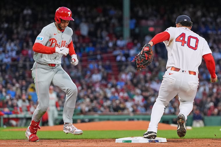 Justin Crawford (left) can't make it to first ahead of Red Sox's Wilson Contreras during the fifth inning of Wednesday's game.
