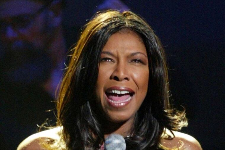 Natalie Cole sings "St. Louis Blues" during the 2003 "Salute to the Blues" concert at Radio City Music Hall. She was inspired by her father, Nat King Cole, at an early age and auditioned to sing with him when she was 11.