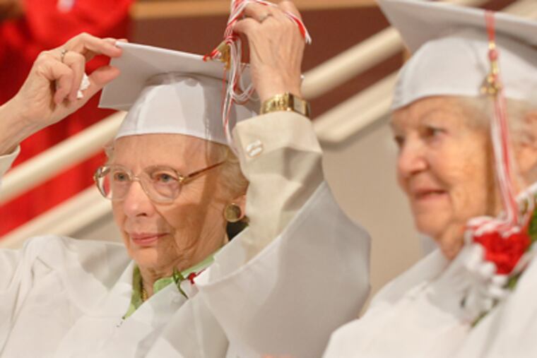 Viewing the ceremony are Dorothy Watson McAuley (left), 85, and Marion Goldsmith Klarman, 91. Both had to leave school early to work. (Tom Gralish / Staff Photographer)
