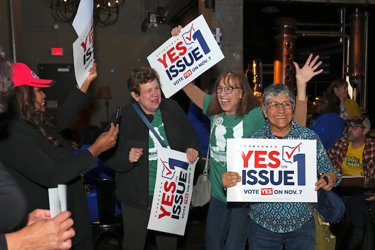 Voters reacts to the passage of Ohio Issue 1, a ballot measure to amend the state constitution and establish a right to abortion, at an election night party hosted by the Hamilton County Democratic Party on Tuesday in Cincinnati. (Kareem Elgazzar/The Cincinnati Enquirer via AP)