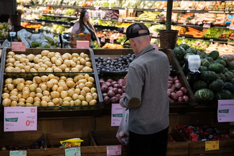 Customers shop in the produce section of a grocery store in May in Portland, Ore. Grocery prices have risen sharply since the start of the U.S. war with Iran.