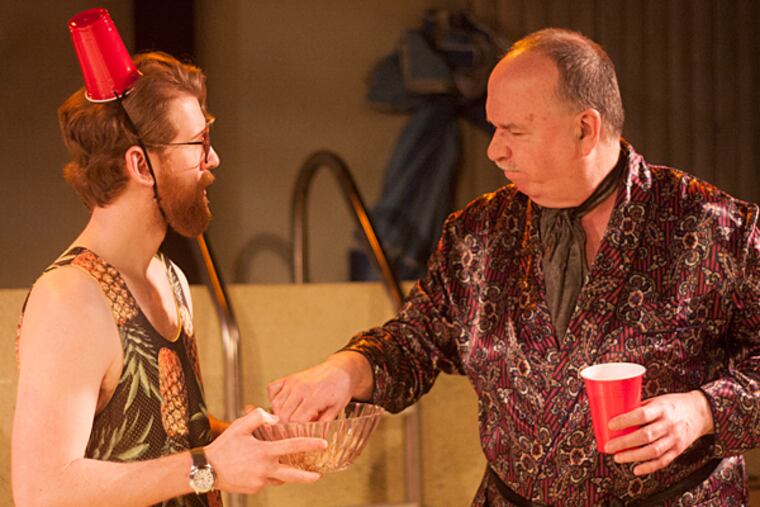 Inis Nua's production of the Enda Walsh play "Penelope.
Burns (Griffin Stanton-Ameisen) acts as the pool's servant and caters to needs of Dunne (John Morrison). (Credit: Katie Reing)