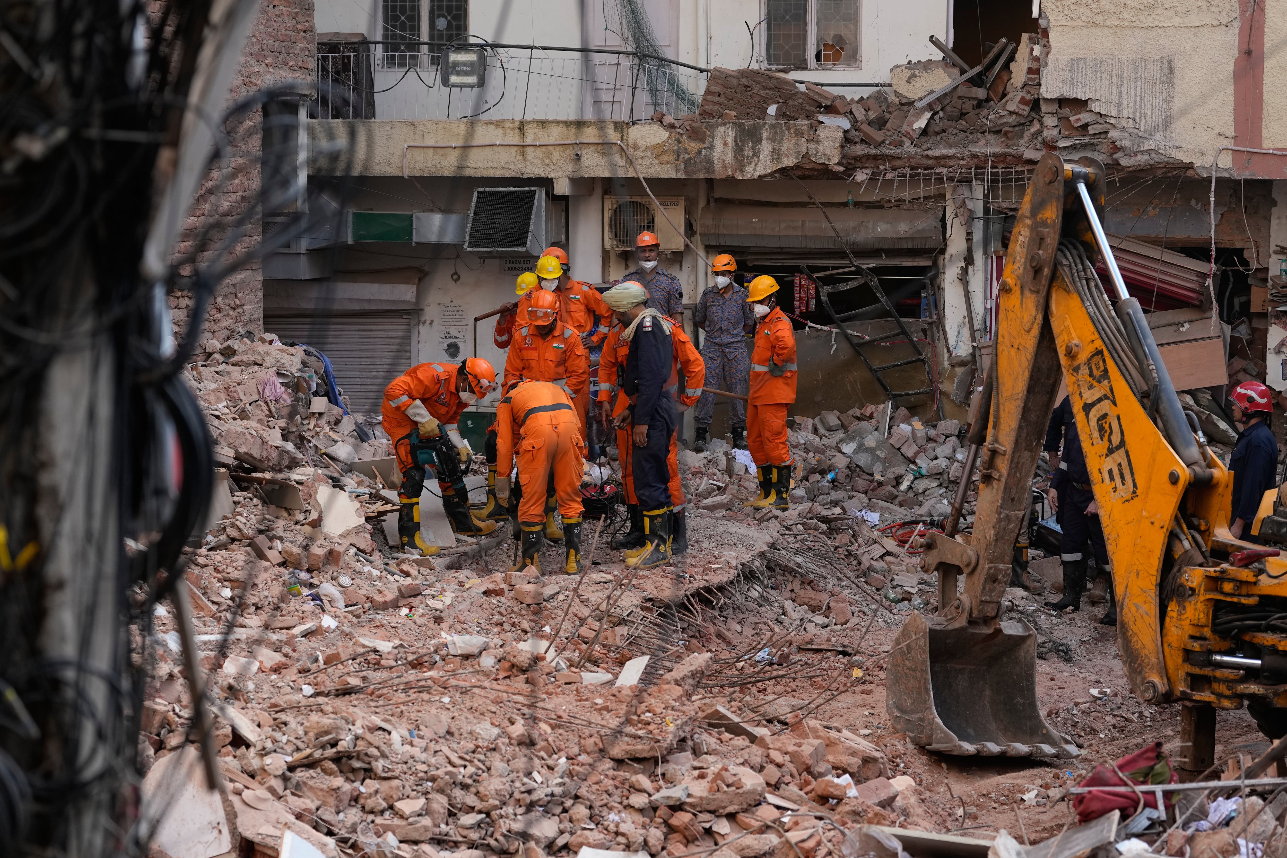 Rescuers look for survivors after New Delhi hostel collapse kills 7