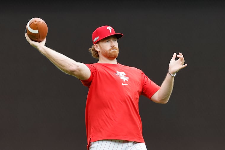 Phillies pitcher Spencer Turnbull throws a football during workouts on Tuesday at Citizens Bank Park.