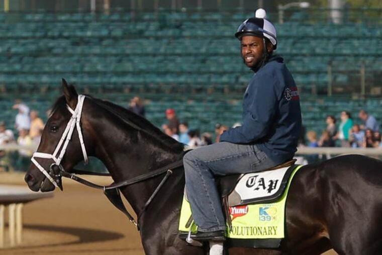 Kentucky Derby entrant Revolutionary and Overanalyze wait to start their morning workouts at Churchill Downs Thursday, May 2, 2013, in Louisville, Ky. Saturday will be the 139th running of the Kentucky Derby. (Morry Gash/AP)