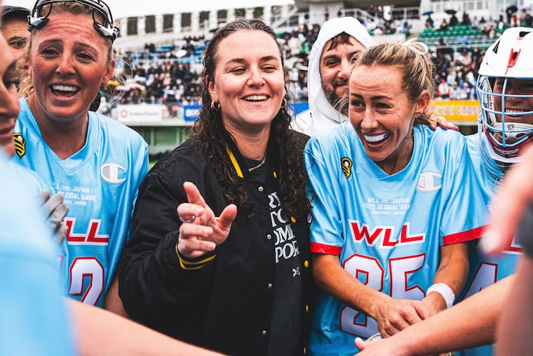 Rachael DeCecco (center) celebrates with WLL. DeCecco is the vice president of lacrosse for the Women's Lacrosse League and Premier Lacrosse League.