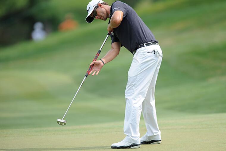 Adam Scott is one of the most prominent users of an anchored belly putter. (Nick Wass/AP)
