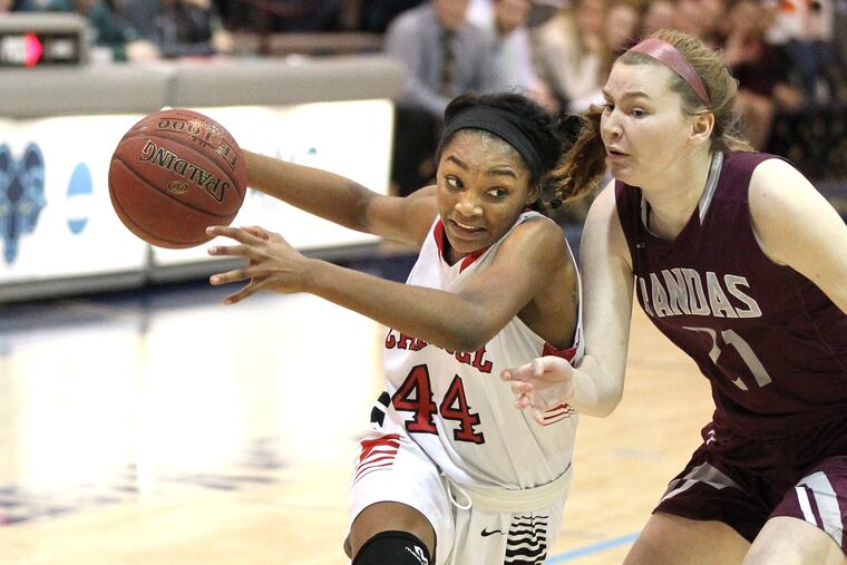 Harlem Jennings (left) of Archbishop Carroll drives by Kelli Curran of Bonner-Prendergast in the Catholic League semifinals.
