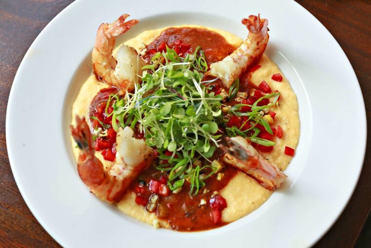 Shrimp are served on cheddar grits at the Little Lion.