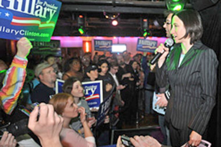 Rue Landau (right) and Ray Murphy, cochairs of Liberty City LGBT Democratic Club, address the crowd at Woody's. Chelsea Clinton popped in last week to lead a presidential pep rally for her mother at the Philadelphia gay bar. (Clem Murray/Inquirer