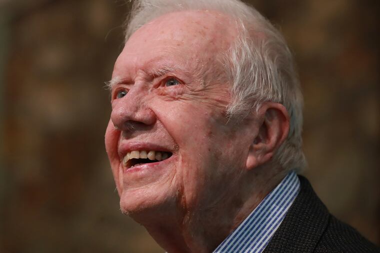 Former President Jimmy Carter smiles as he returns to Maranatha Baptist Church in Plains, Ga., to teach Sunday school, June 9, 2019, less than a month after falling and breaking his hip.