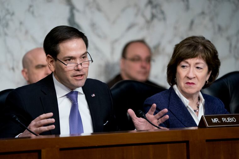 This March 2018 photo shows Sen. Marco Rubio, R-Fla., left, accompanied by Sen. Susan Collins, R-Maine, right, speaking before a Senate Intelligence Committee hearing on election security on Capitol Hill in Washington.