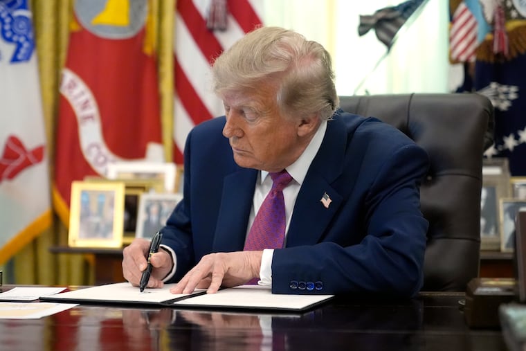 President Donald Trump signs an executive order in the Oval Office of the White House, Thursday, Aug. 27, 2026, in Washington. (AP Photo/Manuel Balce Ceneta)