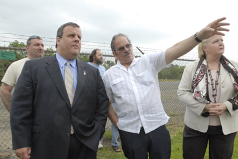 N.J. GOP gubernatorial candidate Christopher J. Christie hears from laid-off worker Al Ashinoff outside the closed Griffin Pipe foundry in Florence. Sen. Diane Allen (R., Burlington) is at right. (April Saul / Staff Photographer)